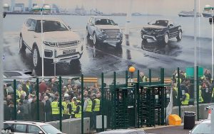 Staff gather outside the Jaguar Land Rover site