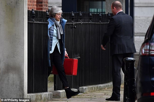 Theresa Mays pictured today leaving Downing Street senior ministers are deeply split over