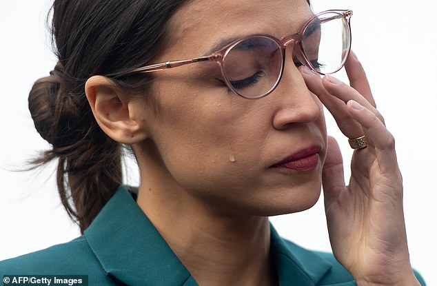 Ocasio Cortez sheds a tear during a press conference calling on Congress t