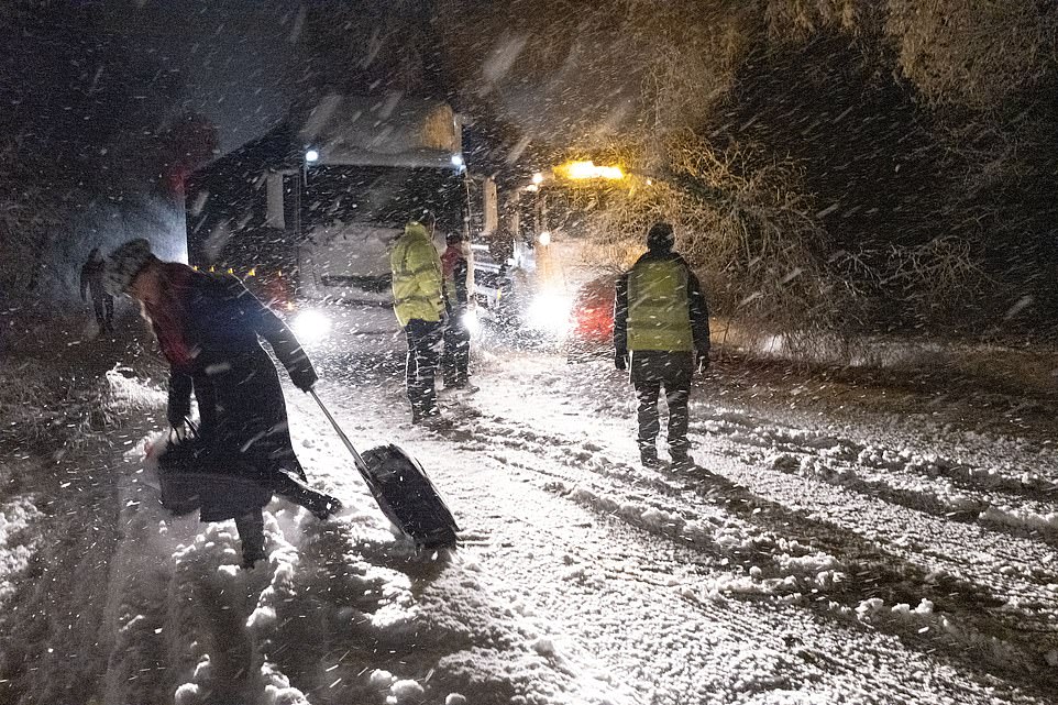 Snow way home Thousands of drivers are TRAPPED on ice rink motorways and an entire town is blocked off as as forecasters warn Britain faces MORE snow and black ice