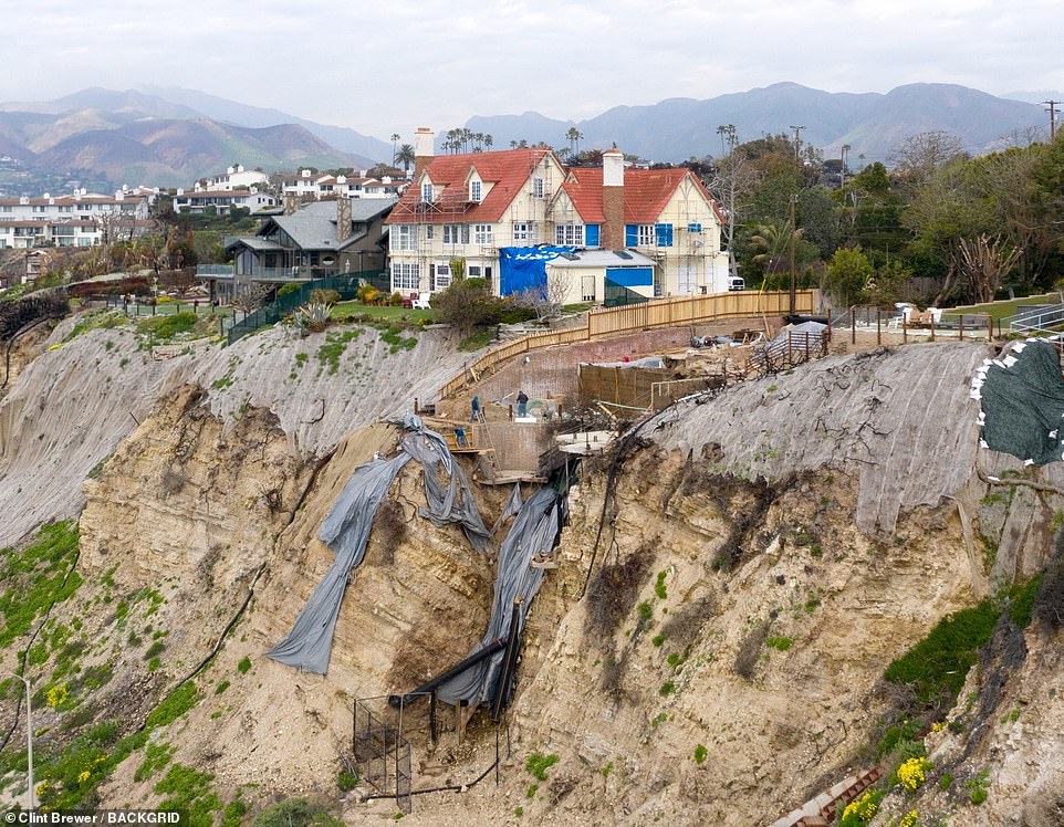 Hopkins 5million red tiled white mansion pictured yesterday is dangerously close to falling off a cliff edge just months after the home miraculously escaped the wildfires seemingly unscathed