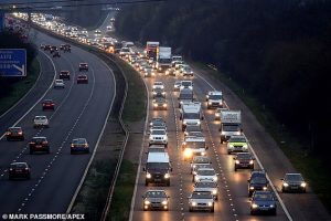 Pro Brexit protesters make their point to motorists on the M5 in Devon with a rolling road block