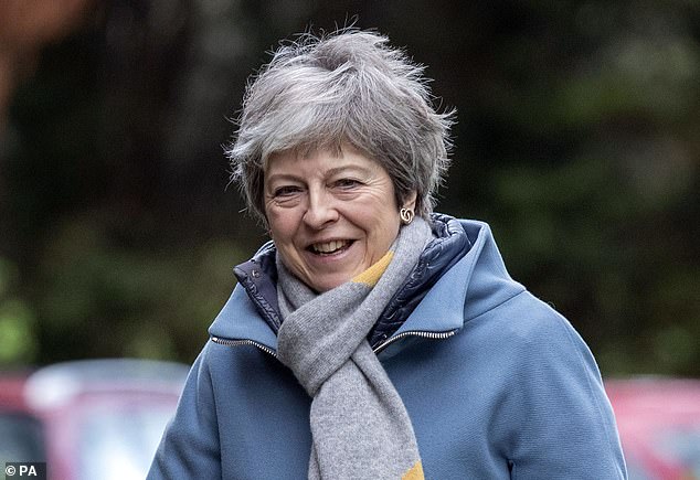 Theresa May pictured today in Maidenhead has been warned she may have to quit Downing Street to have any chance of passing her Brexit deal on Tuesday