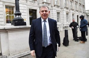 Conservative Party chairman Brandon Lewis leaves the Cabinet Office in central London on April 4