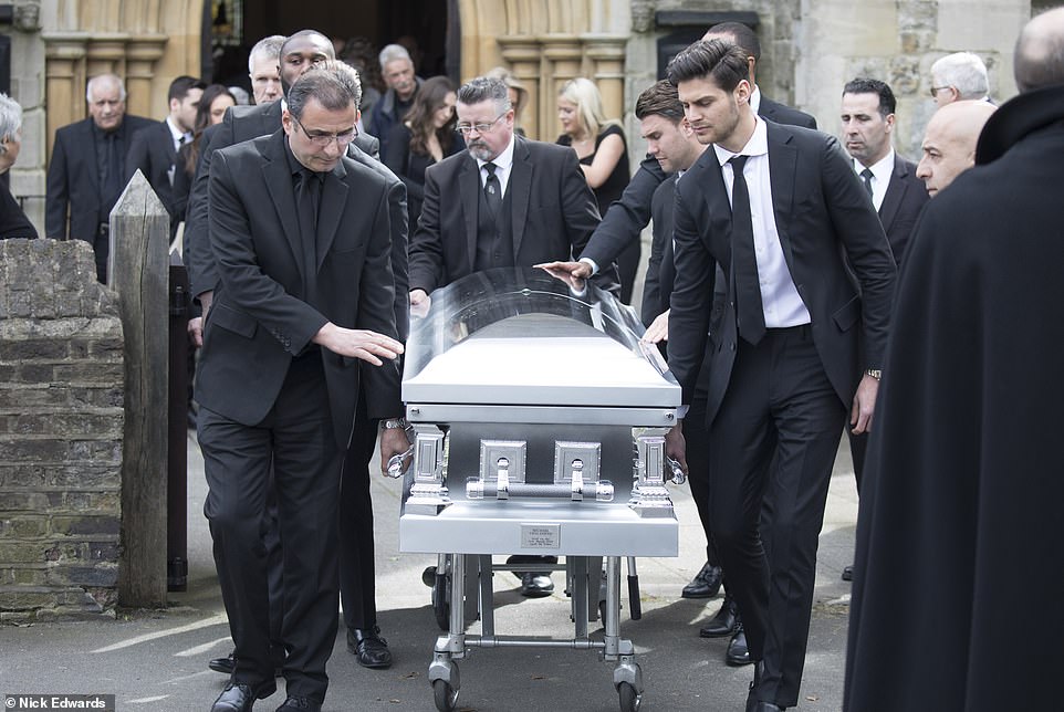 The coffin of Mike Thalassitis is wheeled away from the church following an emotional ceremony at Christ Church in Southgate north London